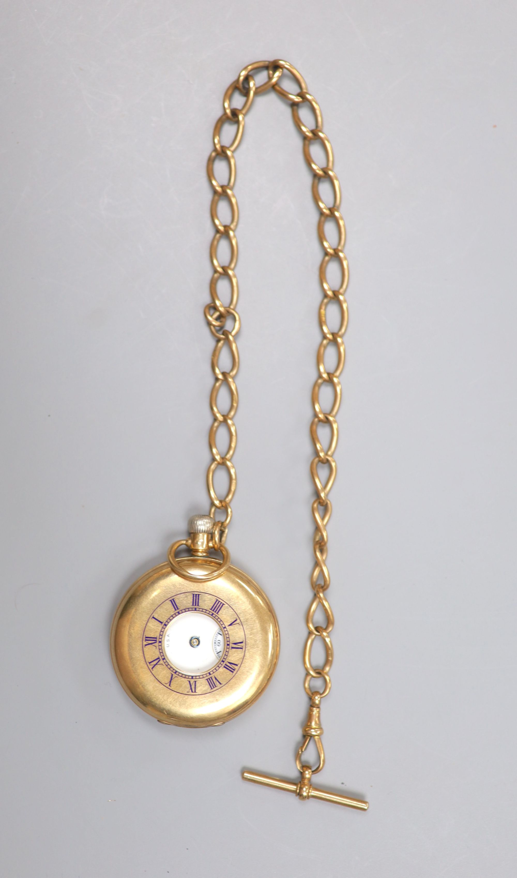 A George V 9ct gold Waltham half hunter pocket watch, with a 9ct gold albert.